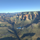 a plane flying over the grand canyon in microsoft flight sim